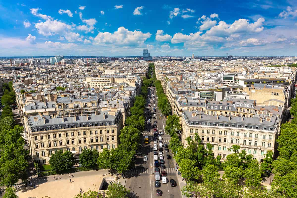 Arc de Triomphe in Paris, France pairs tree-lined Champs-Élysées stretching across central Paris with cityscape details.