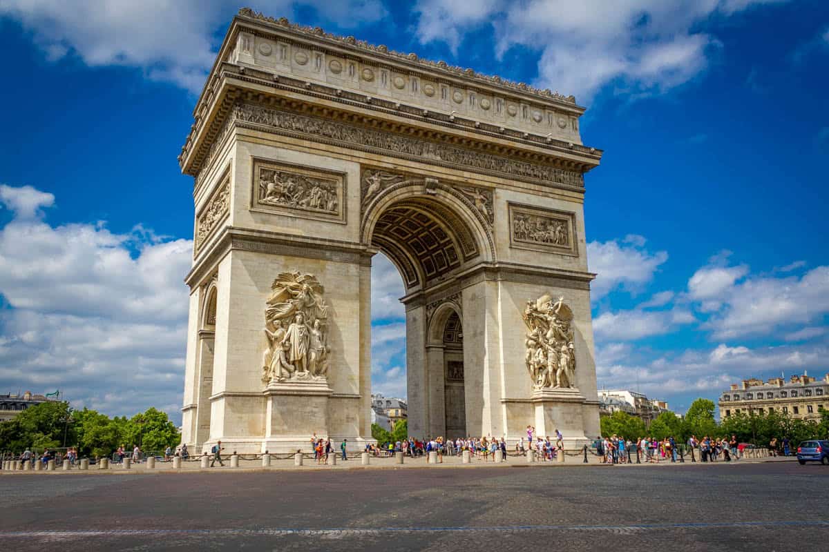Angled exterior of the Arc de Triomphe with sculpted reliefs — Arc de Triomphe, Paris, France.