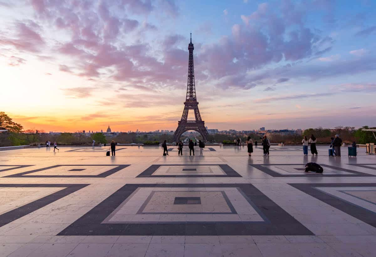 Eiffel Tower standing beyond the geometric Trocadéro plaza — Eiffel Tower, Paris, France.