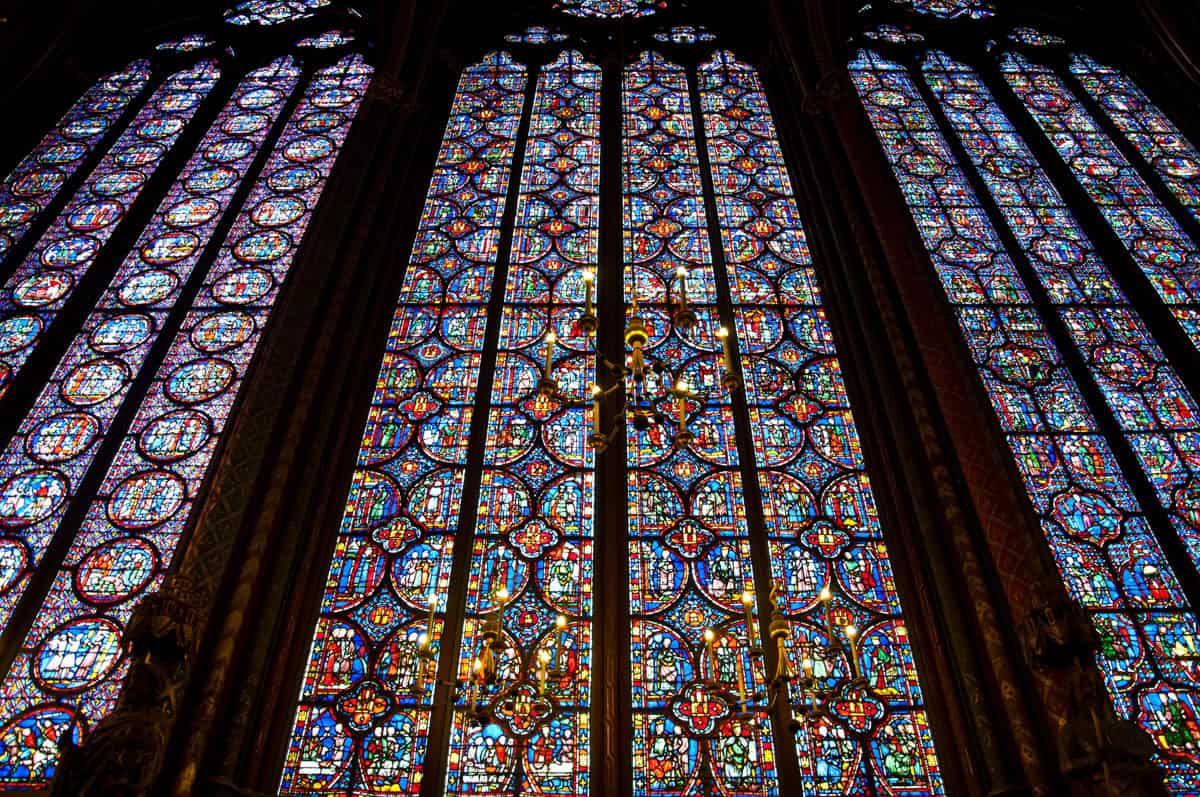 Tall stained-glass panels filling a pointed Gothic window — Sainte-Chapelle, Paris, France.
