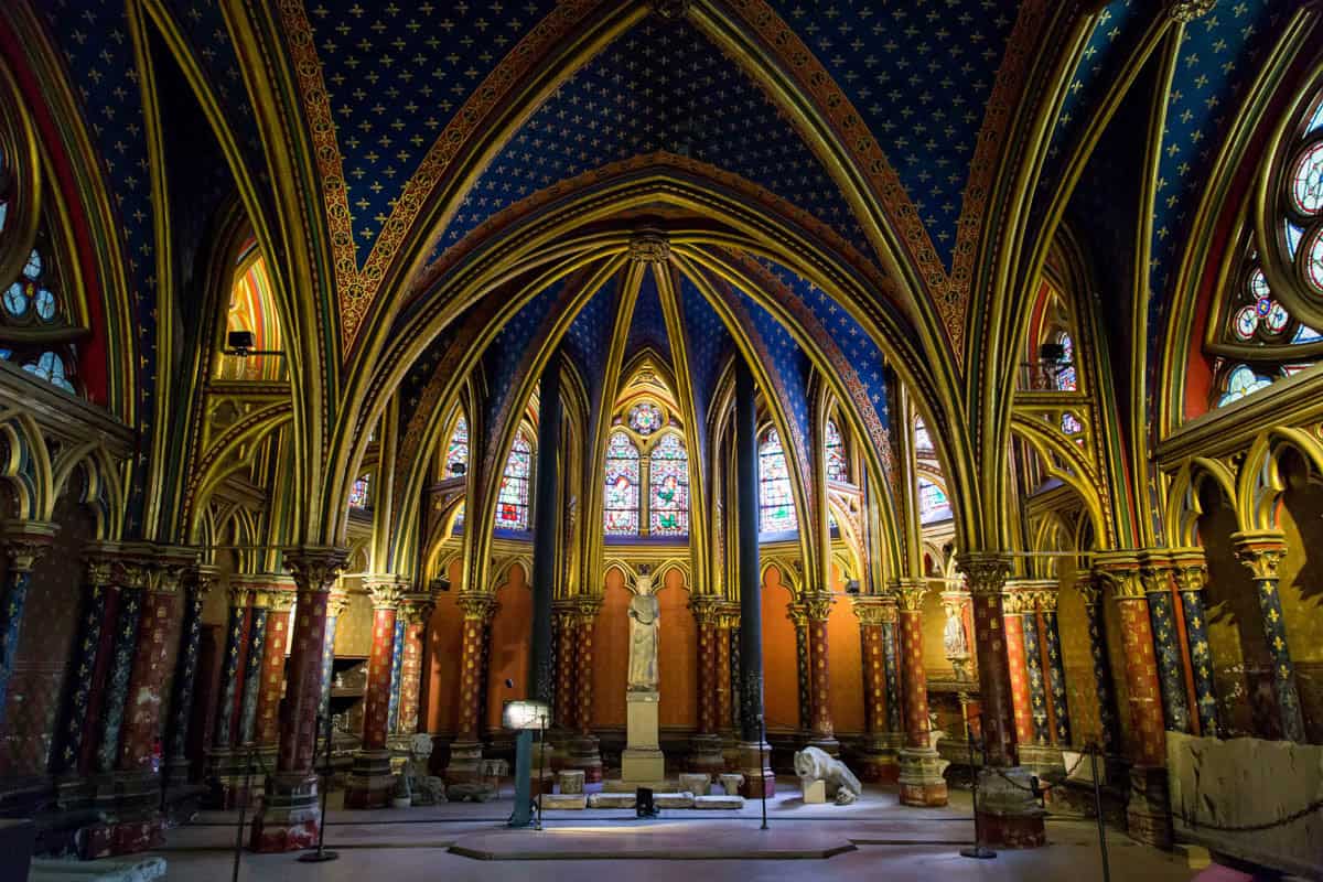 Sainte-Chapelle in Paris, France, featuring lower chapel nave with patterned vaults and stained-glass windows beside stained glass features.